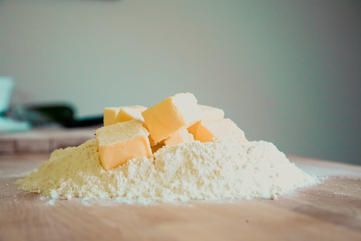 Butter and flour on a kitchen counter for baking